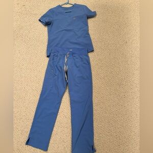 FIGS size small scrub top and scrub pant.
Light blue.
